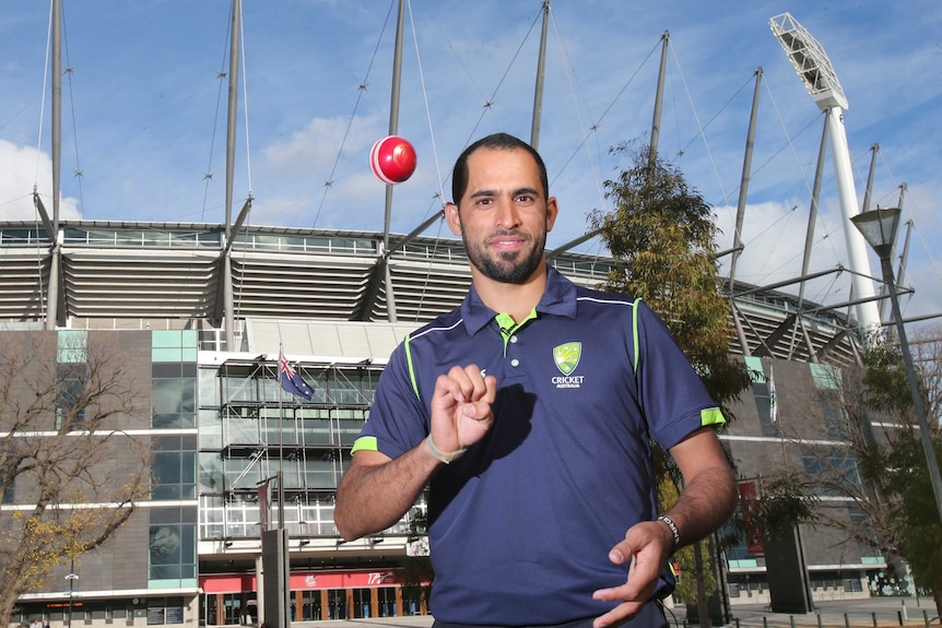 Legspinner bowler Fawad Ahmed stands outside the MCG