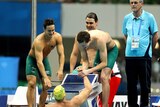 Team Australia congratulates Kenrick Monk after winning the men's 4x200m freestyle relay.