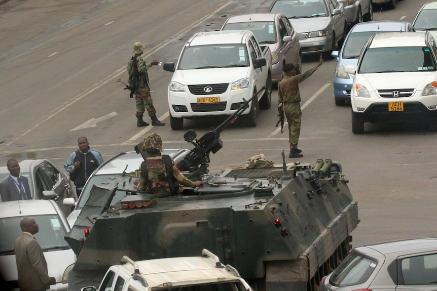 Military vehicles and soldiers patrol the streets in Harare.