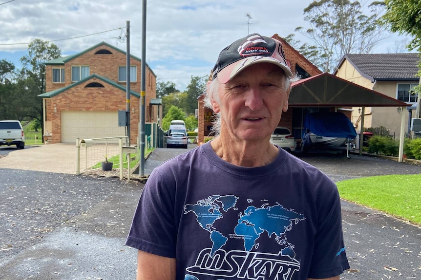 A man in a blue t-shirt