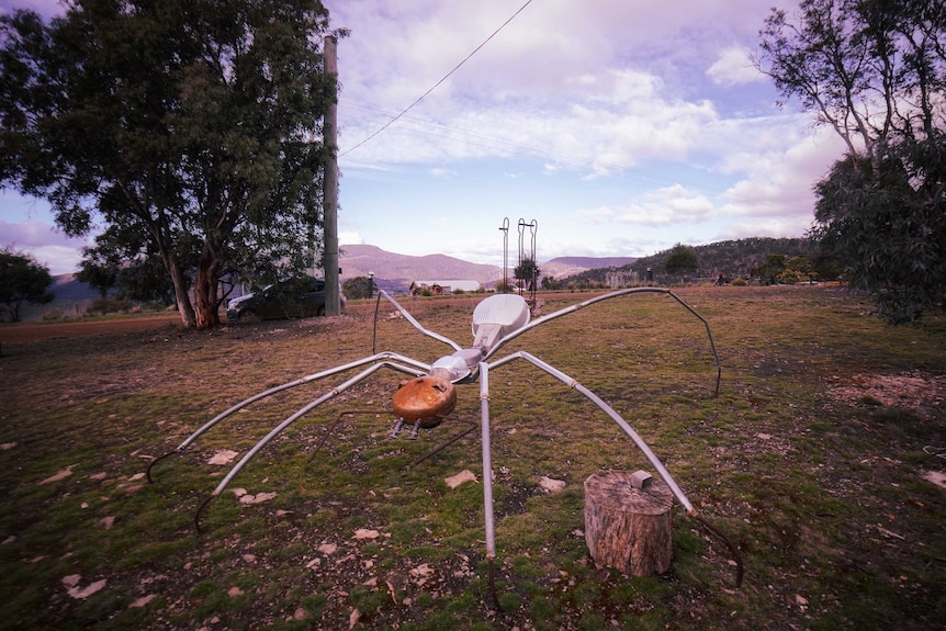 A metal sculpture of a fire ant.