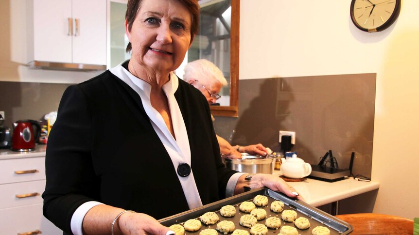 CWA Tasmanian President Lindy Cleeland holding raw shortbread