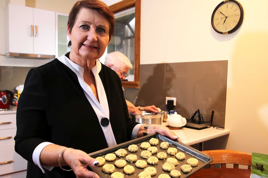 CWA Tasmanian President Lindy Cleeland holding raw shortbread