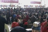 Crowds fill train stations in China during peak travel periods.
