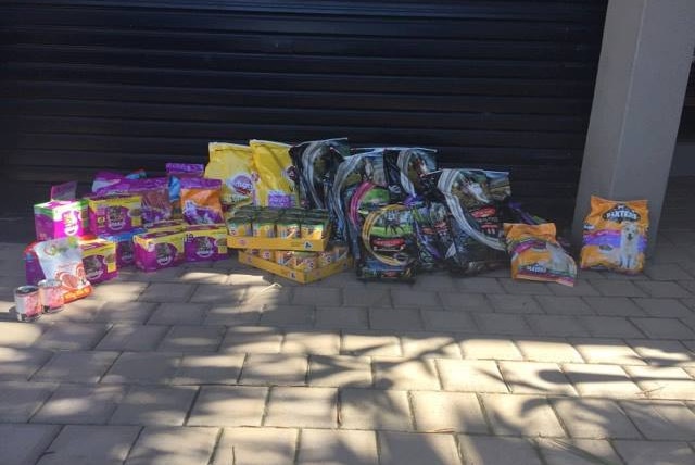 A donation of cat and dog food given to pet foodbank