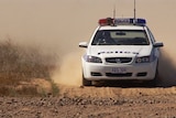 police car in dust