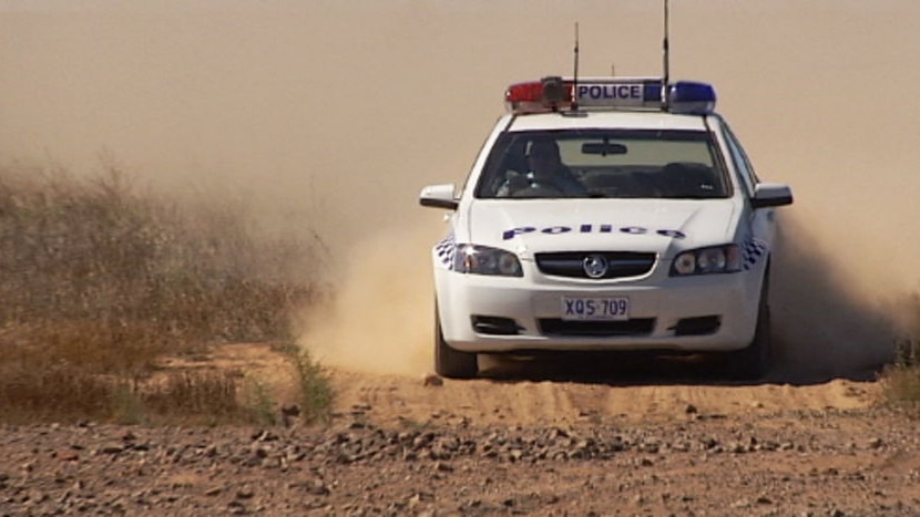 police car in dust