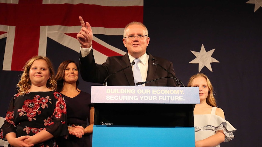 Scott Morrison points as he gives his victory speech after winning the Federal election