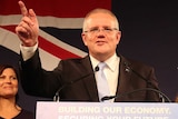 Scott Morrison points as he gives his victory speech after winning the Federal election