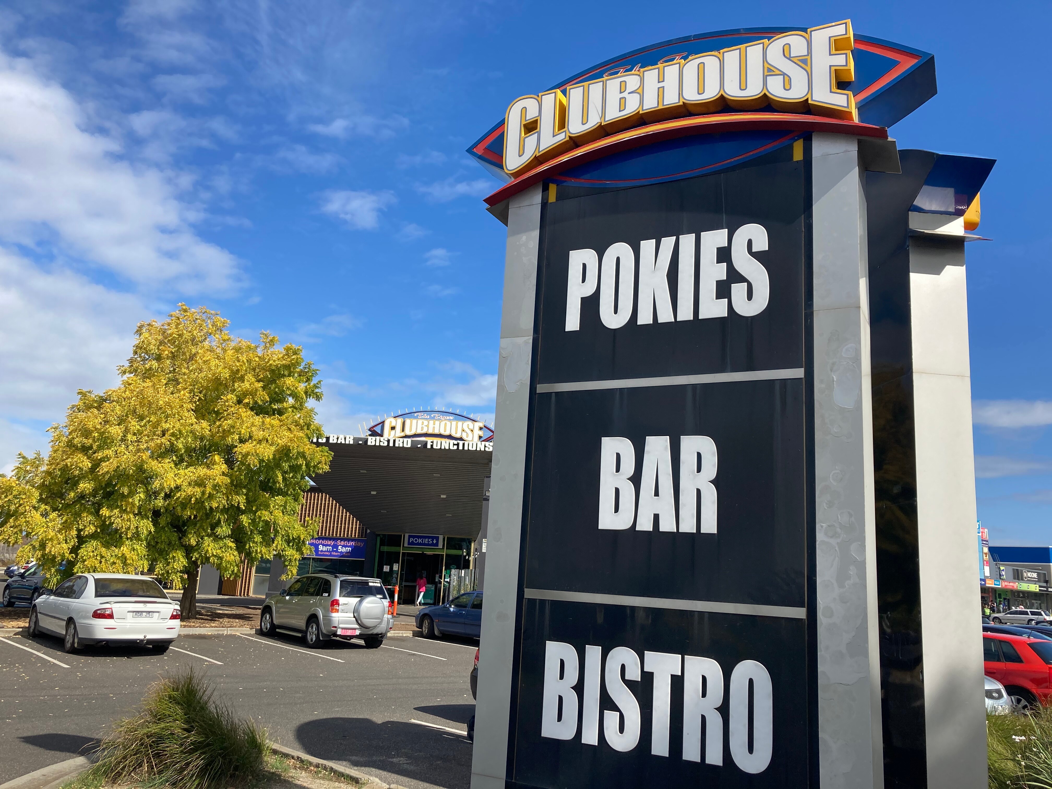 A sign saying POKIES - BAR - BISTRO at the Tigers Clubhouse.