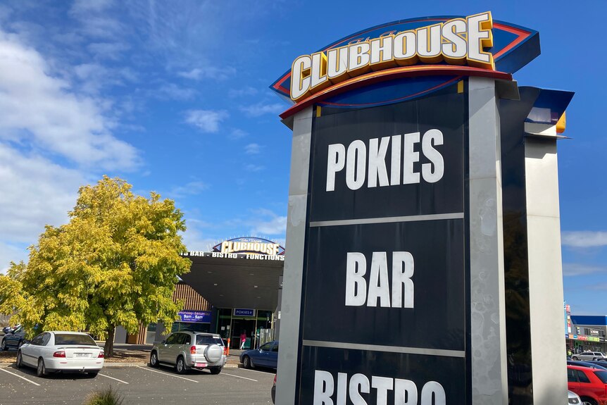 A sign saying POKIES - BAR - BISTRO at the Tigers Clubhouse.