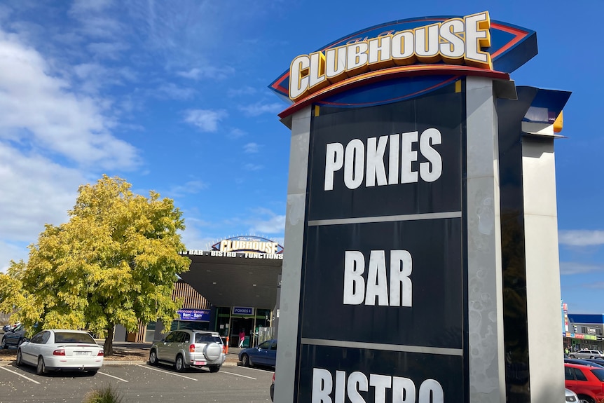 A sign saying POKIES - BAR - BISTRO at the Tigers Clubhouse.