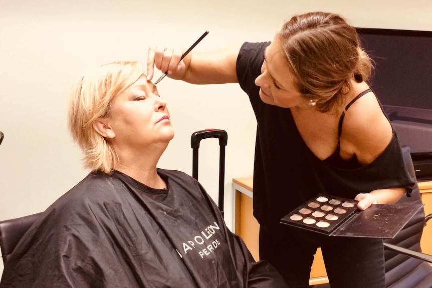 Lisa Rathgen at work as a makeup artist for a story on choosing a career that matches your personality