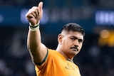 A Wallabies player gives the thumbs up after a Test against the Pumas.