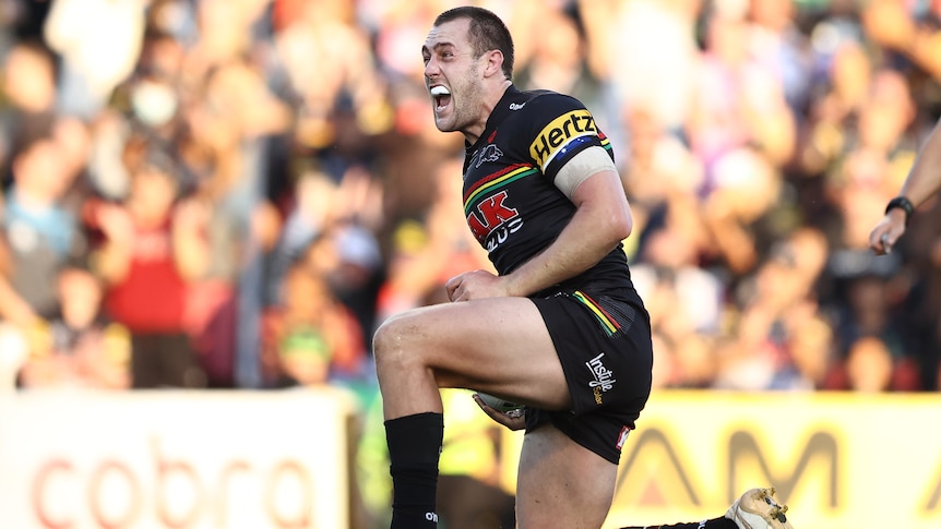 A Penrith Panthers NRL player celebrates a try against the Canberra Raiders.