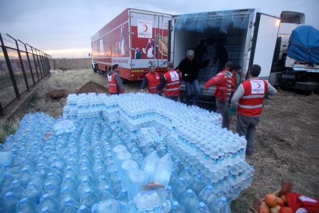 Aid workers unload water in Turkey