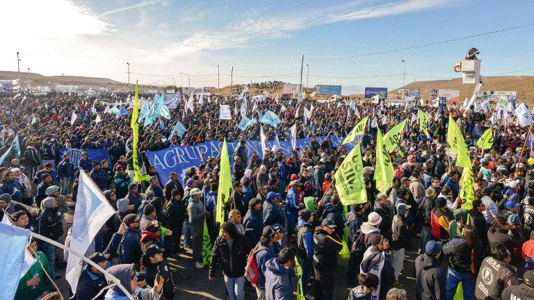 Thousands of oil and gas workers wave flags protest in Comodoro Rivadavia.