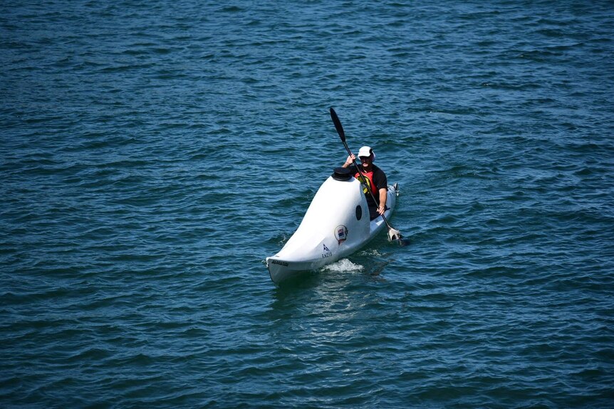 Scott paddling his kayak near the Coffs Harbour Jetty