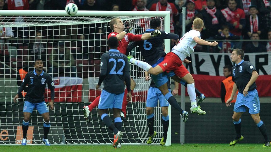 Poland's Kamil Glik (2nd R) equalises after a blunder from England keeper Joe Hart.