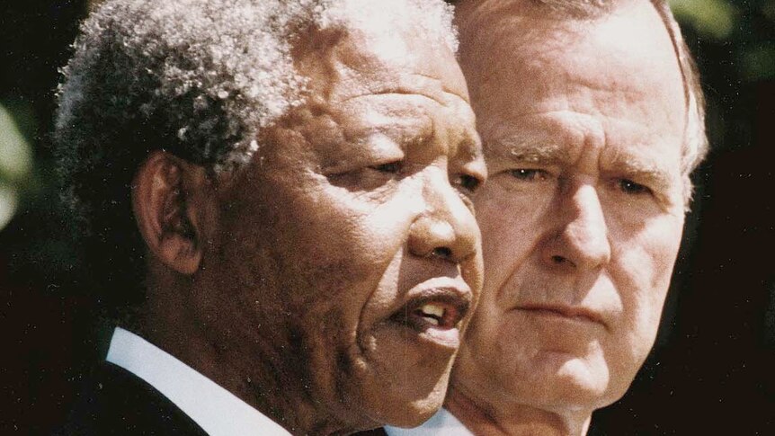 Nelson Mandela (left) and George HW Bush
