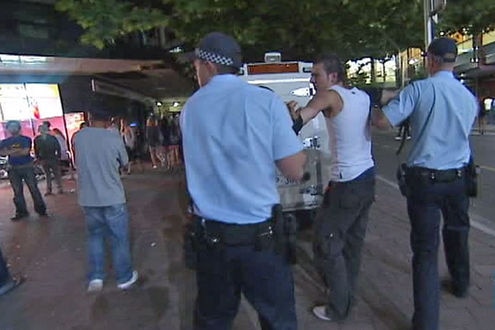 Police arrest a young, drunken man in Canberra's city centre