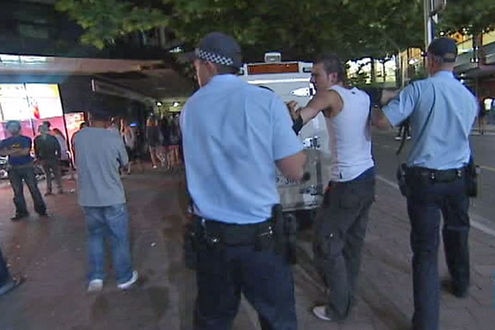 Police arrest a man in Canberra's city centre.