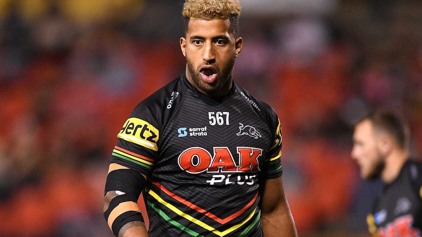 Viliame Kikau has his mouth open as he walks around on the field