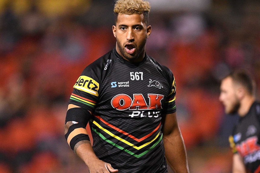 Viliame Kikau has his mouth open as he walks around on the field