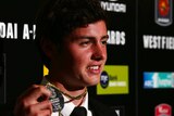 All smiles ... Marco Rojas poses with the Johnny Warren Medal