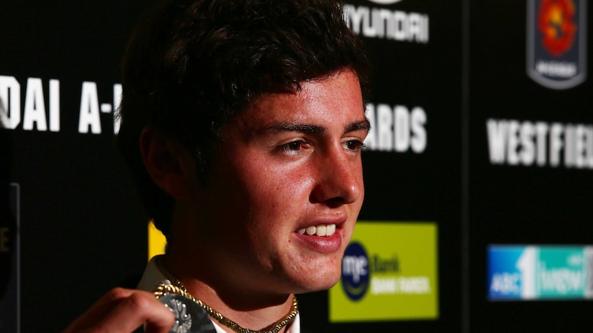 All smiles ... Marco Rojas poses with the Johnny Warren Medal