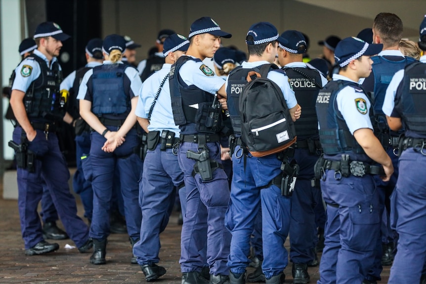 Police in uniform gather
