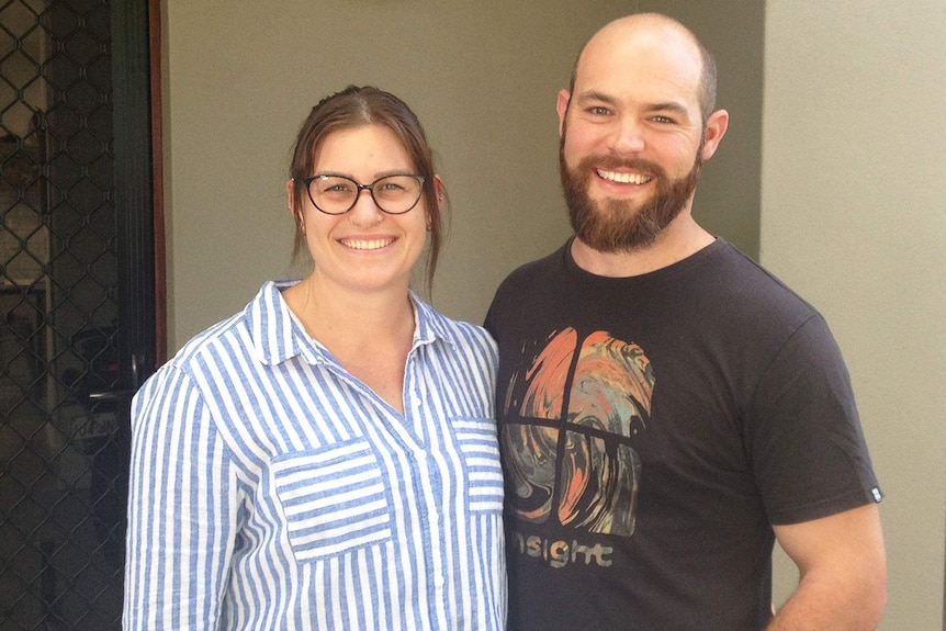 Shane Brien and Llawella Bidmead outside their Brisbane townhouse