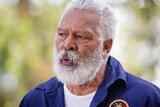A head and shoulders shot of Ernie Dingo speaking during a media conference.