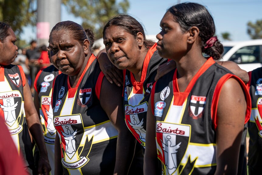 A photo showing Epenarra Saints women's players standing next to each other.