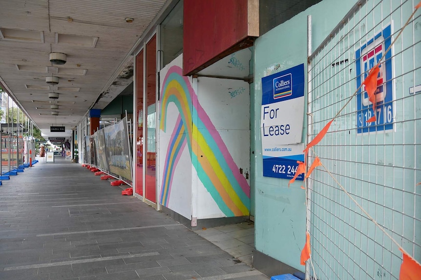 An unused building on Flinders Street in Townsville, it has a For Lease sign out the front and is in need of repair