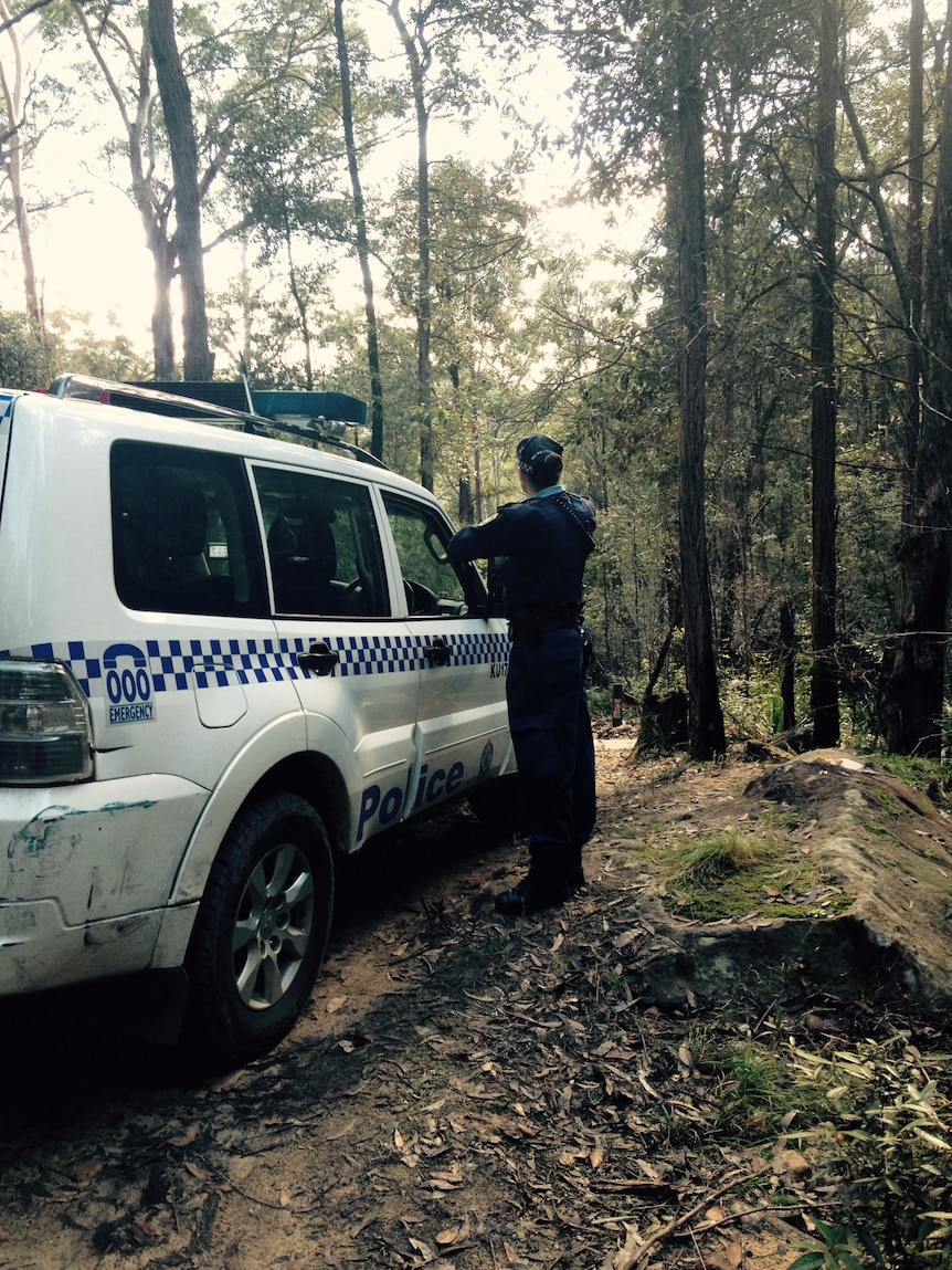 Police investigate the area where a woman's body was found at Hornsby