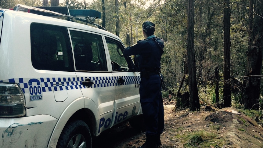 Police investigate the area where a woman's body was found at Hornsby