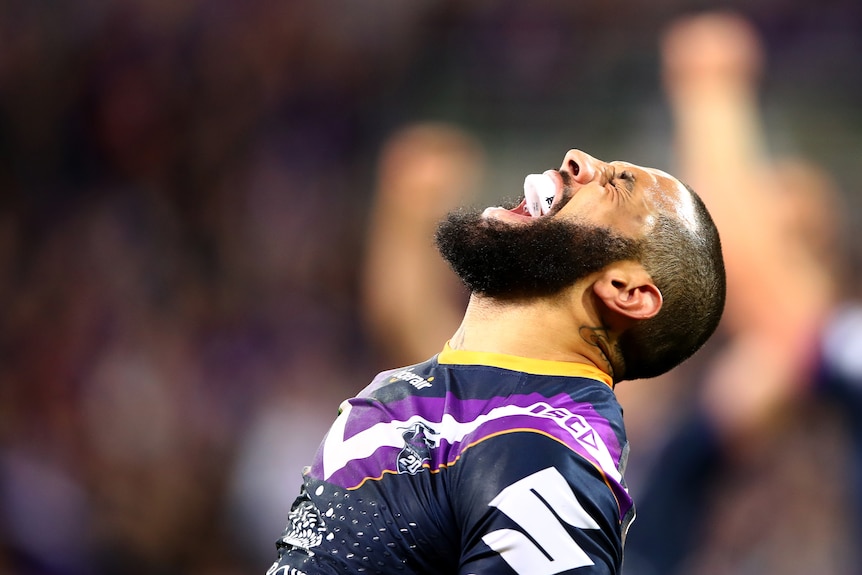 Headshot of rugby league player screaming during a game