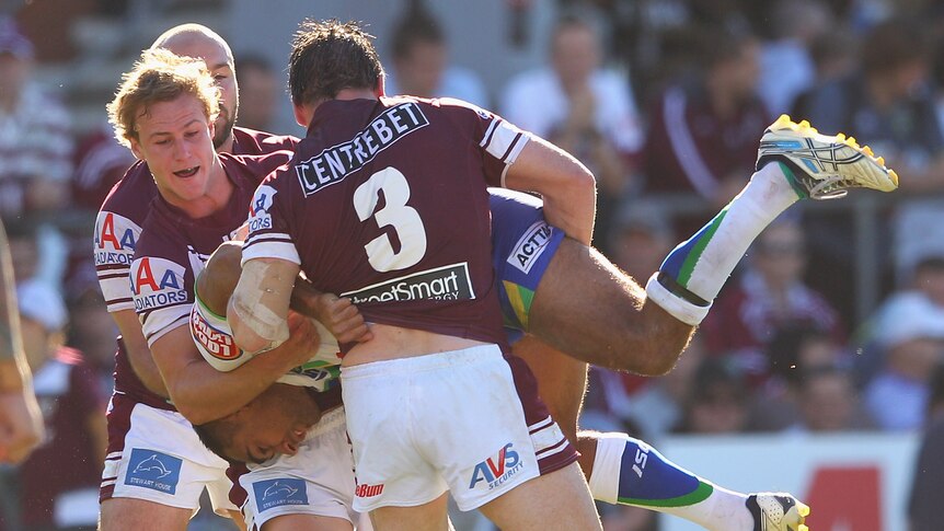 Tough 2012 continues ... Canberra winger Reece Robinson is dumped in his side's loss.
