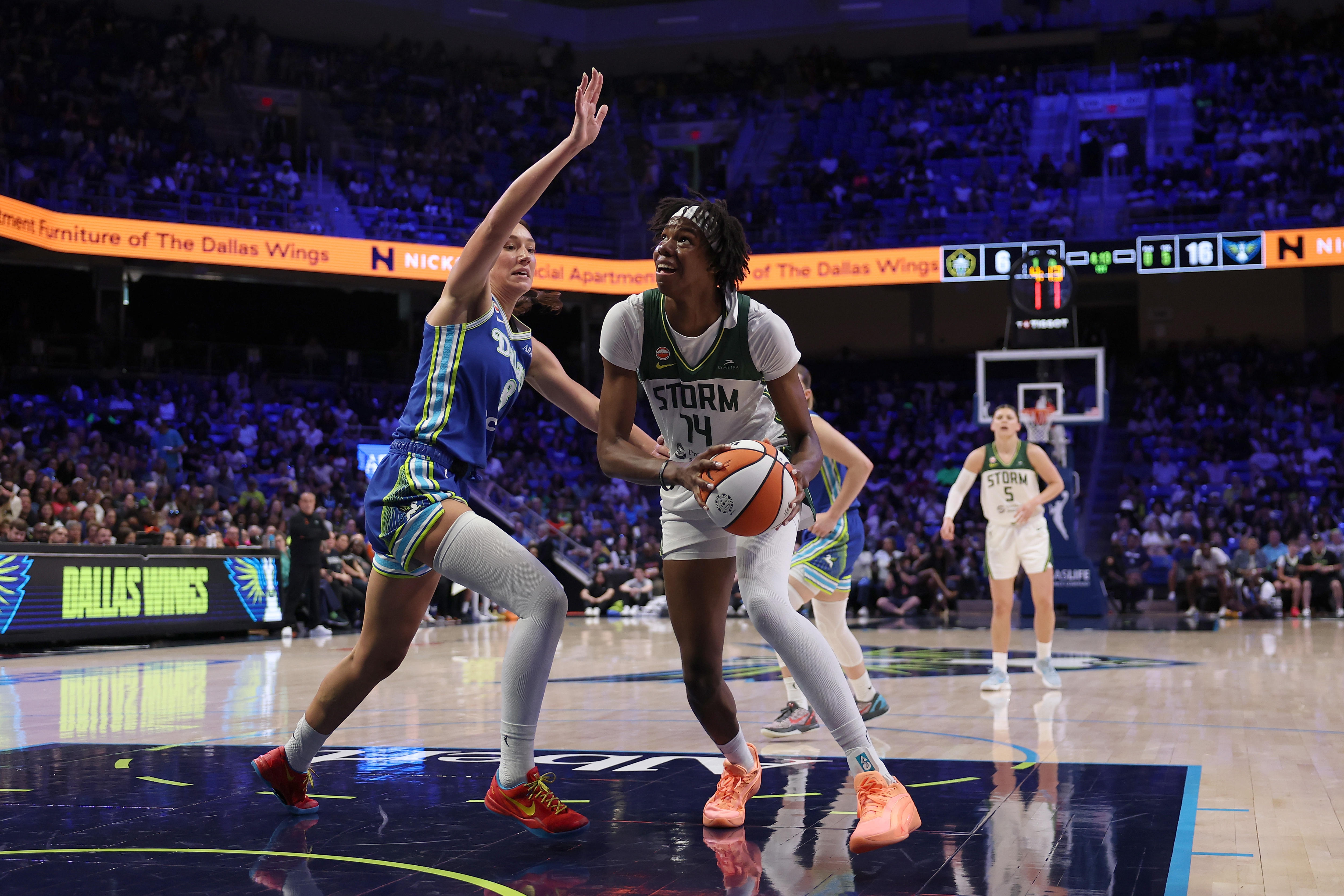 Seattle Storm player Dominique Malonga is defended by Dallas' Alanna Smith during a WNBA game