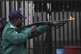 Bangladesh police officer fires rubber bullets