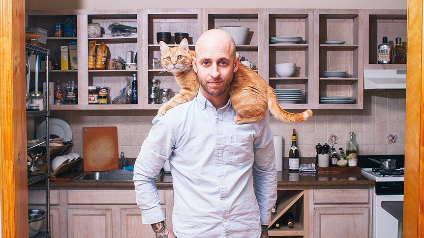 A portrait of man with his cat shot by Brooklyn-based photographer David Williams.