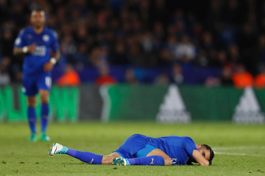 Leicester City's Riyad Mahrez lies on the ground during the loss to Atletico Madrid.