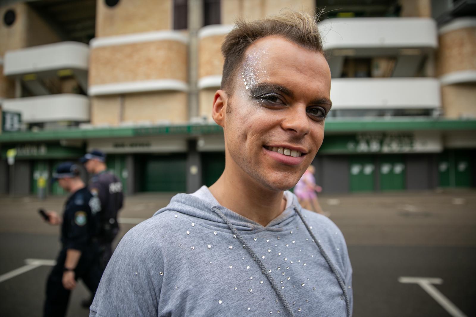 a young male with glitter on his face