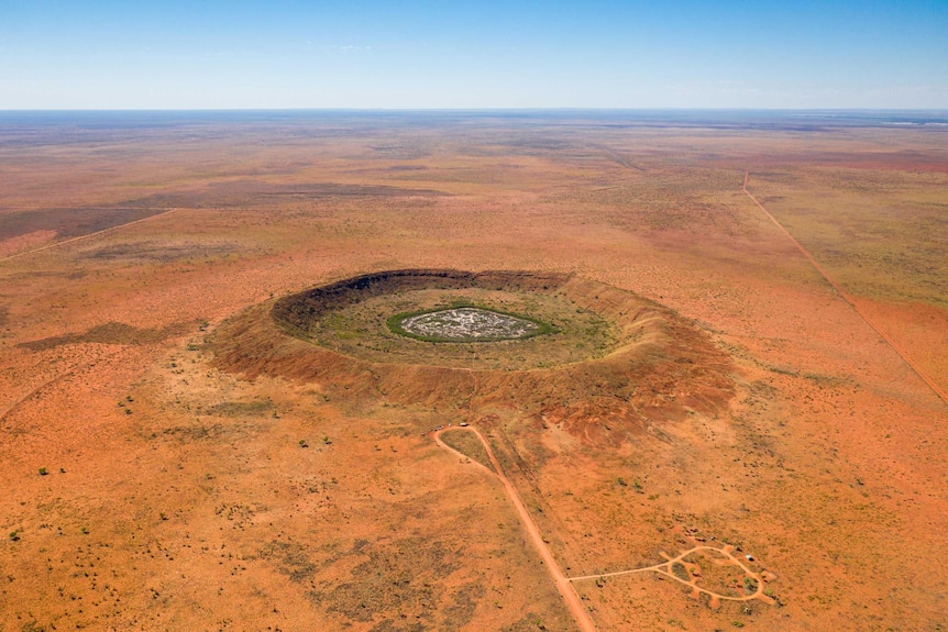 A large crater in the Australian desert.