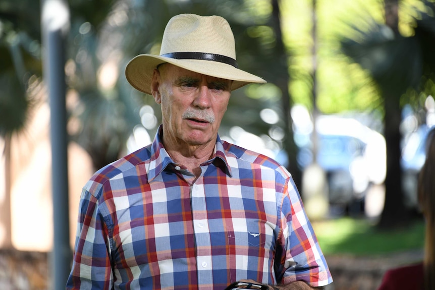 Warren Snowdon wearing a hat speaks in an interview.