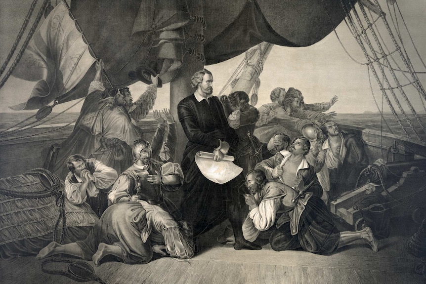 Illustration depicting Christopher Columbus standing proud on a ship deck looking towards land while his crew praise him.