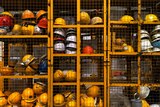 Shelves stacked with miner's helmets