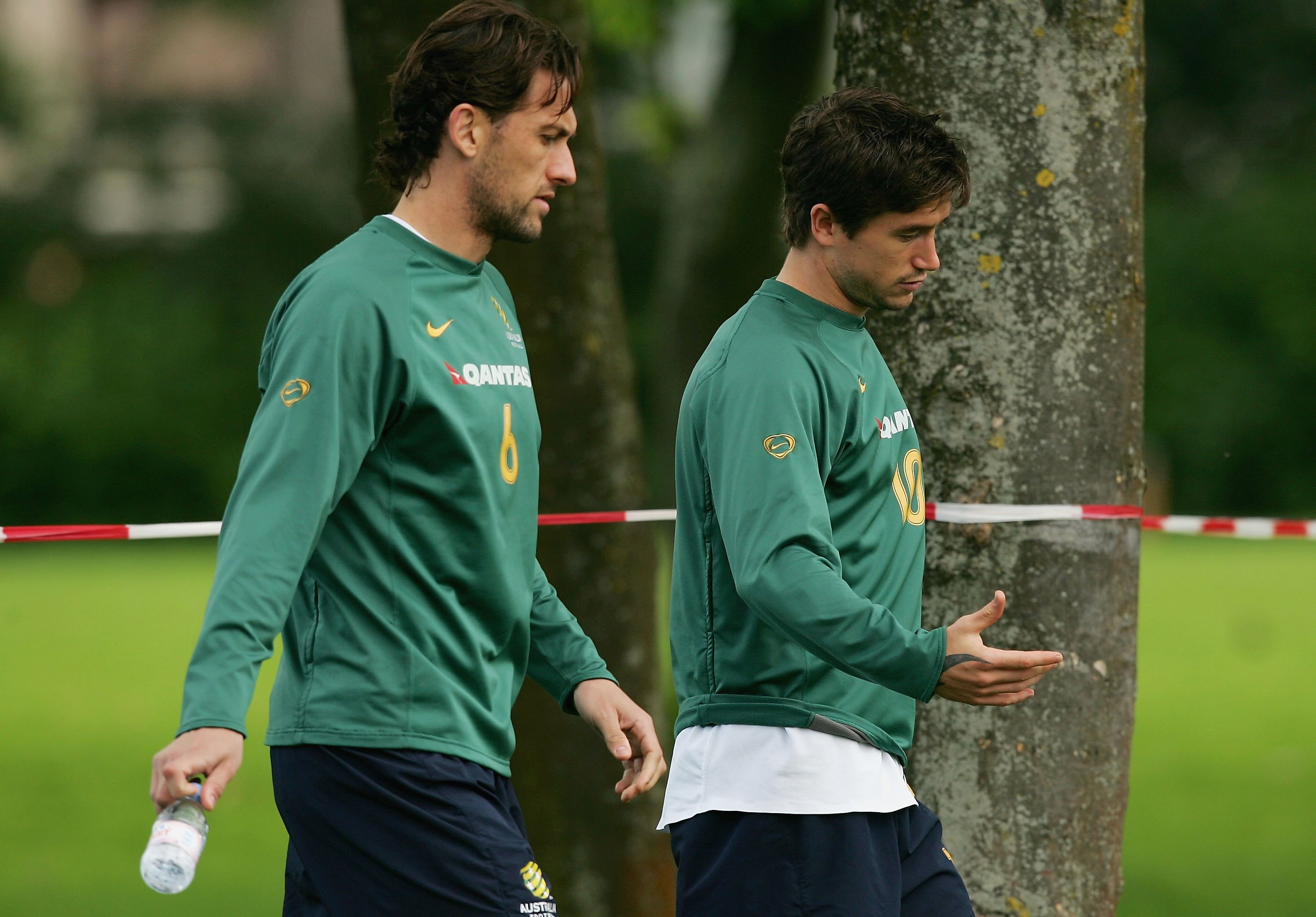 Tony Popovic and Harry Kewell of Australia head for a fitness test during a training session