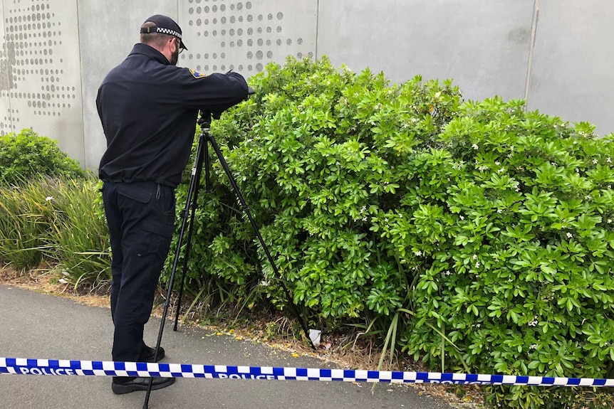 Forensic photographer at the scene where a man's body was found at Royal Hobart Hospital.